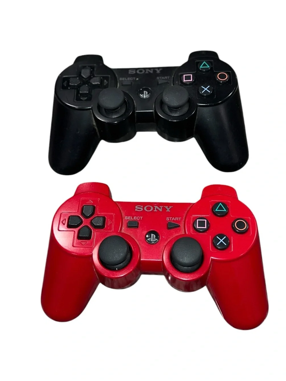 Sony Black and Red Dual PlayStation Controllers